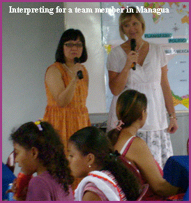 Angie interpreting at a Christian outreach in Managua, Nicaragua .